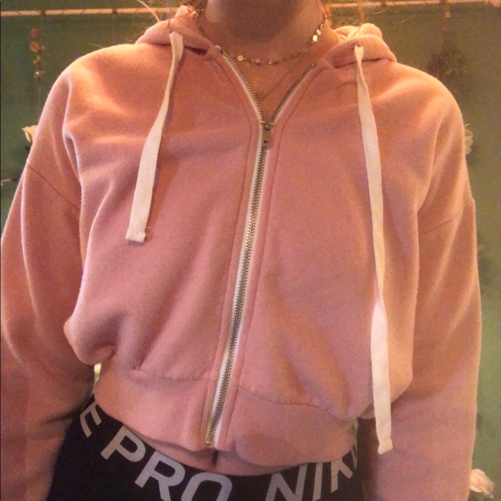 Pink cropped zip up hoodie with white strings!